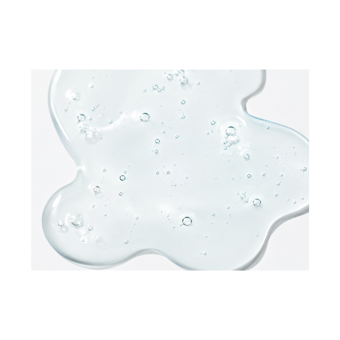 Clear gel-like substance with bubbles on a white background