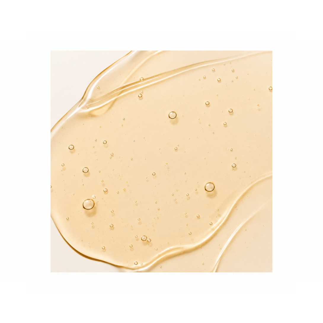 Close-up of a beige gel with bubbles on a white background