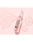 Texture of Janssen Cosmetics Brilliance Shine Elixir Ampoules on a white background.